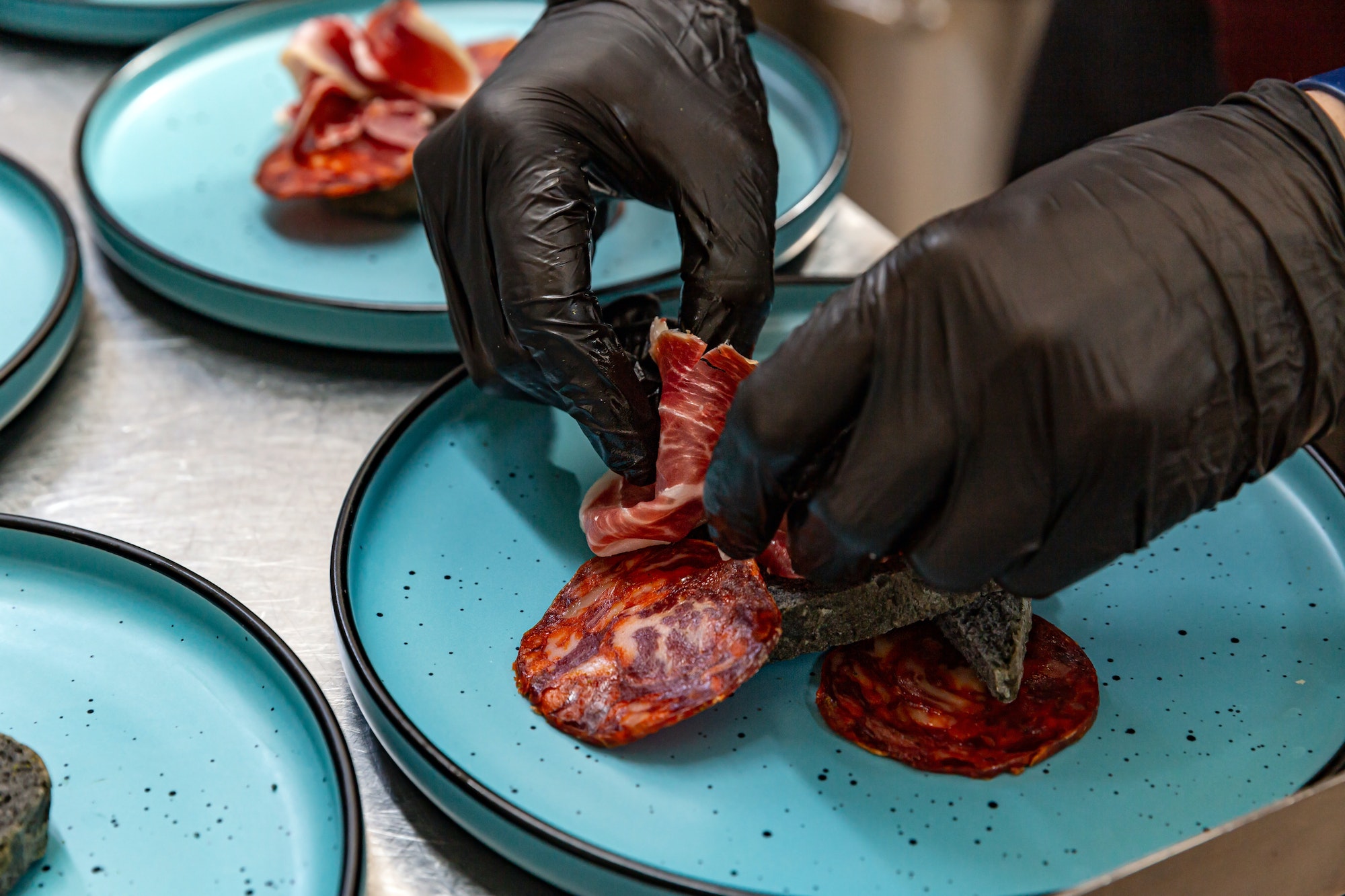 Chef arranging jamon